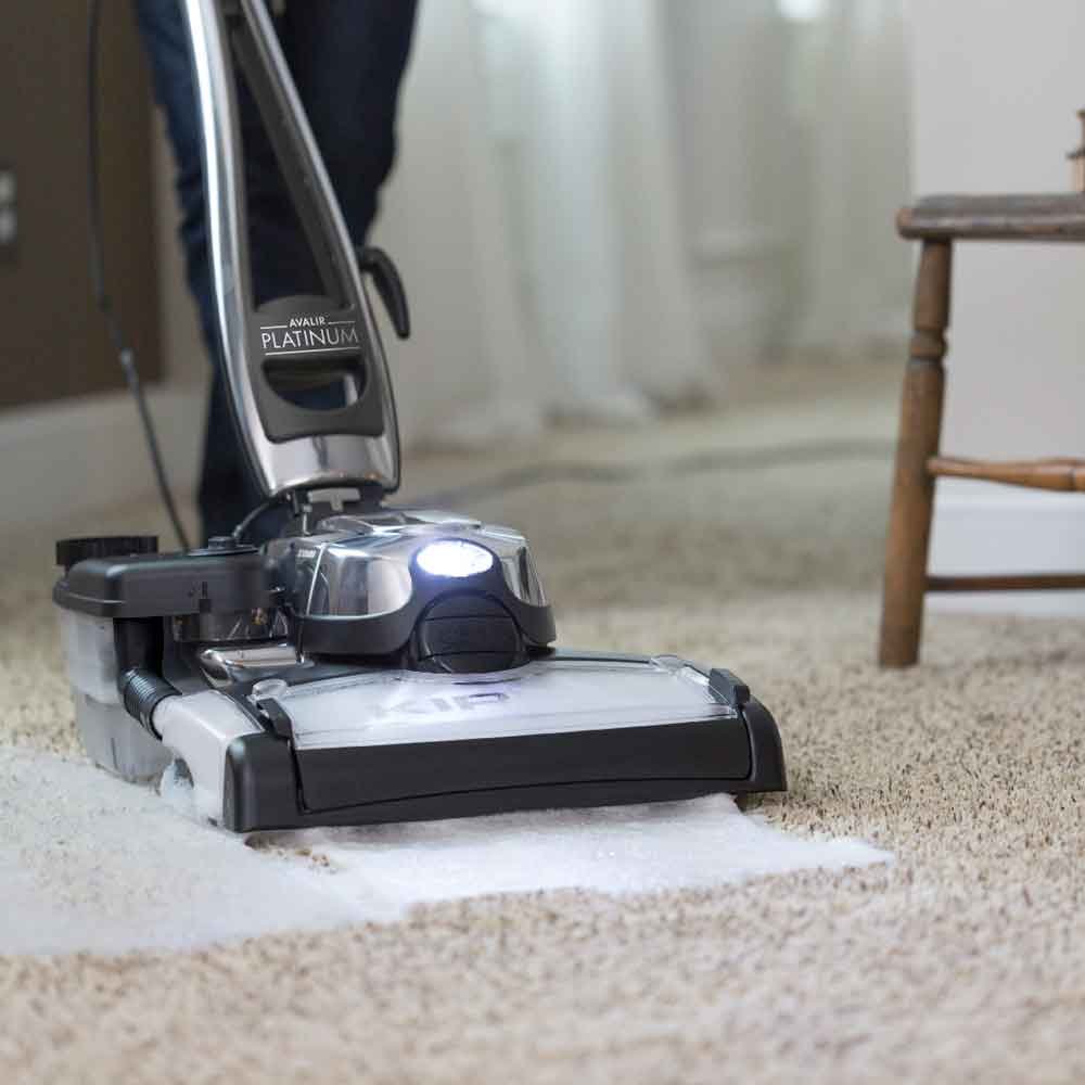 Avaur Platinum carpet cleaning machine in action on beige carpet in home interior